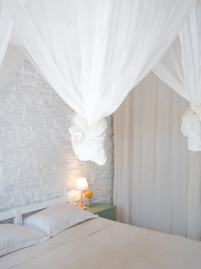 A bed beneath a white canopy